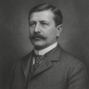 Porträt von Joseph Babinski (1857–1932) in Schwarz-Weiss, mit Schnurrbart, Anzug und Krawatte, ruhiger und bestimmter Ausdruck vor neutralem Hintergrund.